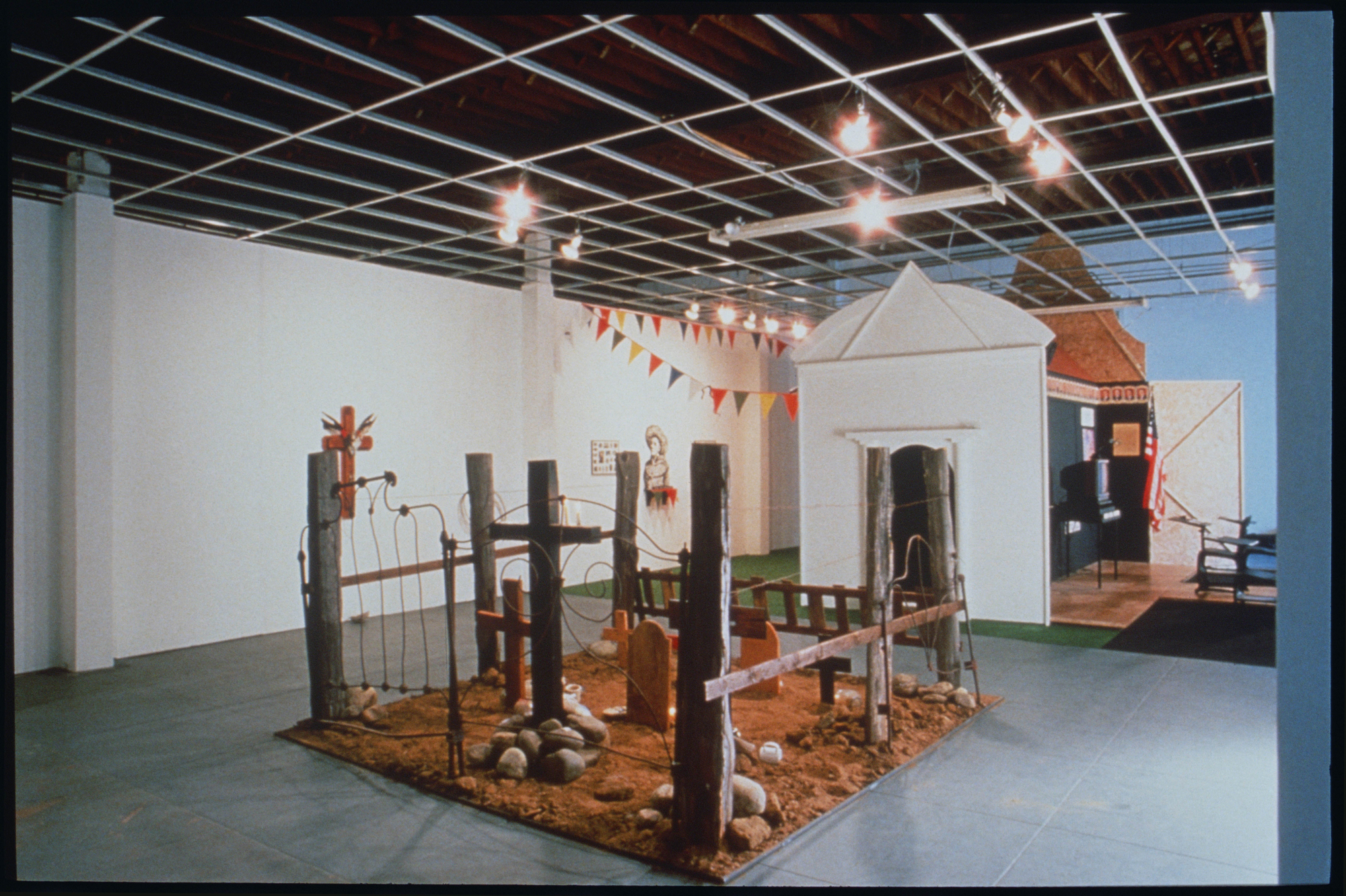 galley view with Mission-like structure and cemetery