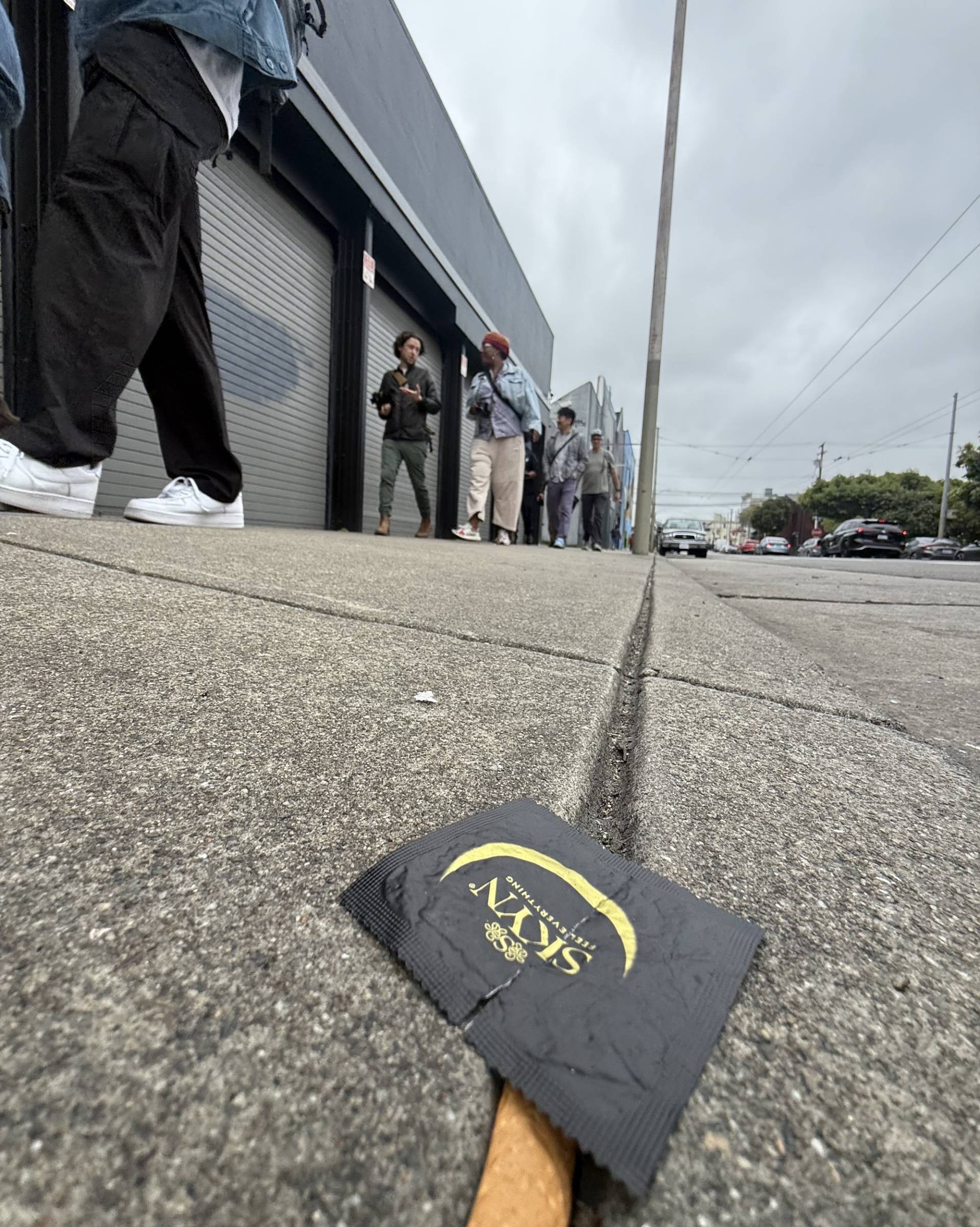 A condom wrapper rests on the street in San Francisco. 