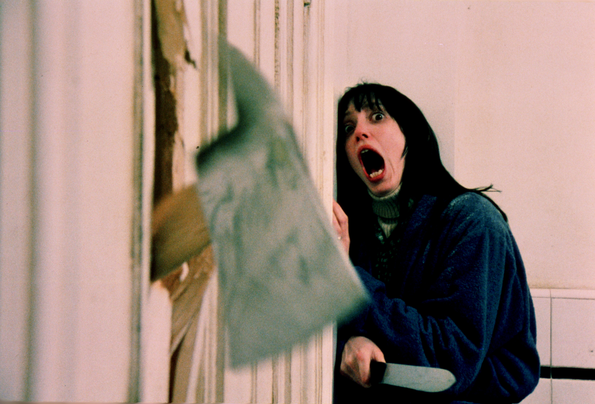 woman screams as axe head comes through door