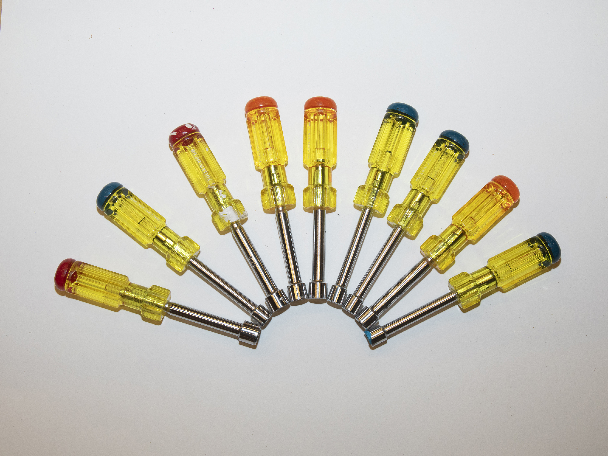a spread of socket wrenches arranged in an arc