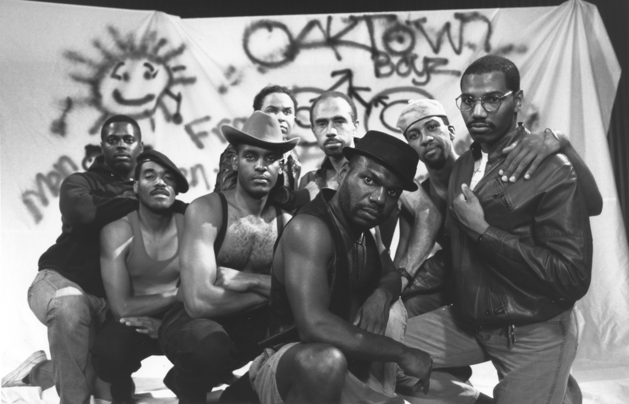 close group of Black men pose together