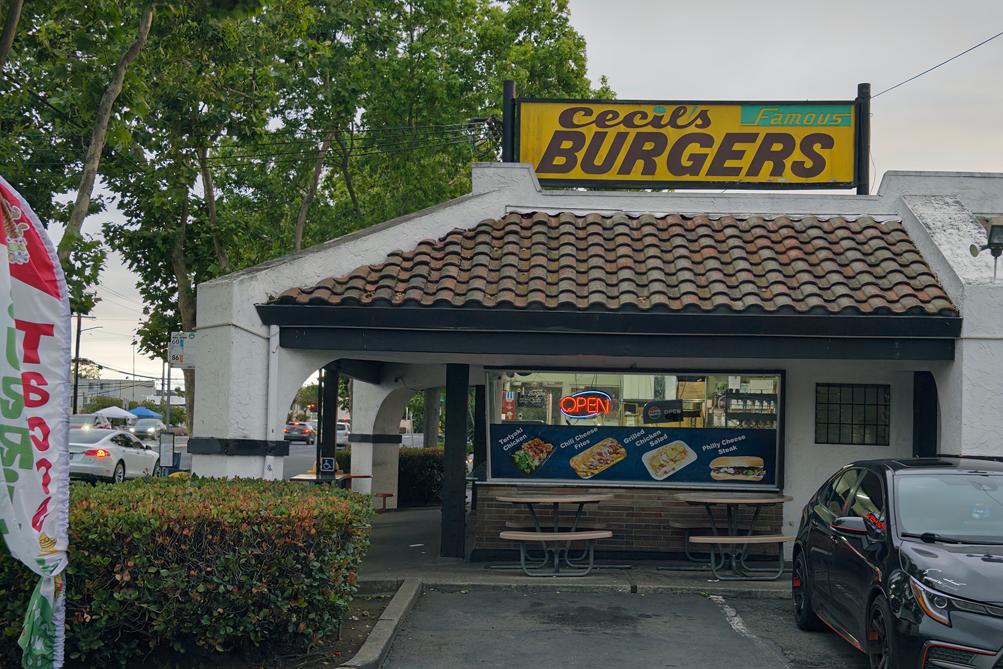 An old-fashioned burger shop. The sign above reads, "Cecil's Famous Burgers."