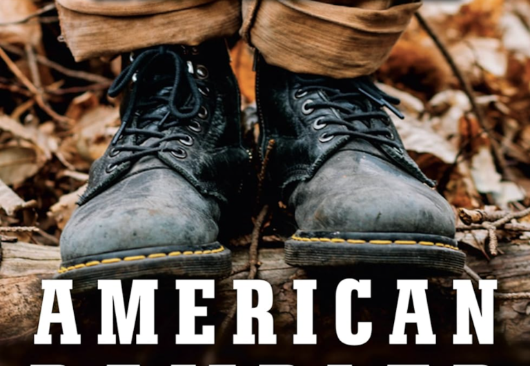 A book cover featuring a photo of a man's feet, wearing black army boots, standing in brown leaves.