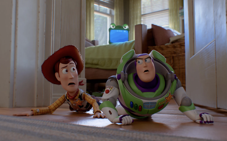 Animation featuring a toy cowboy and toy spaceman lying next to each other in a doorway.