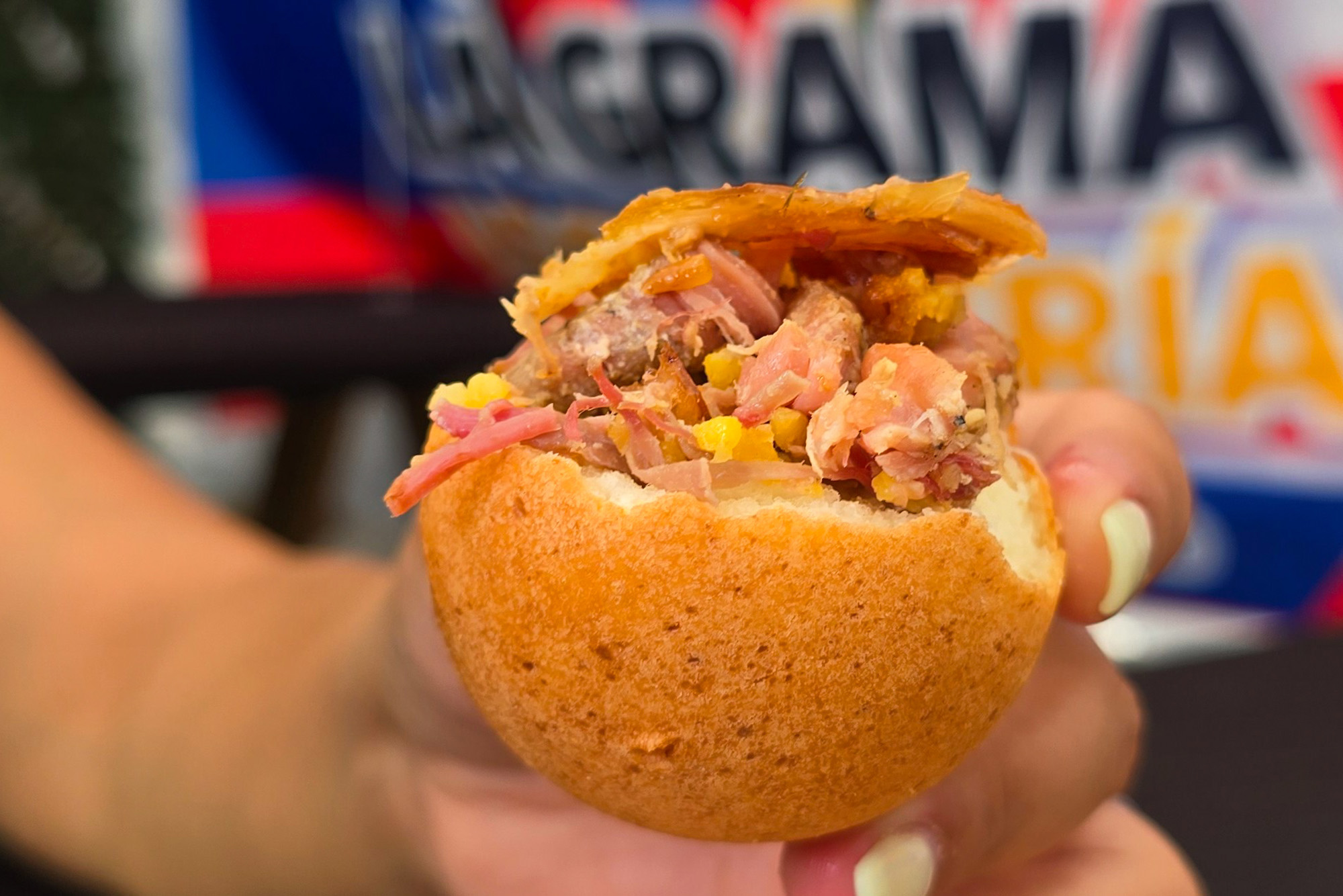Rice and crispy pork skin piled on top of a cheese fritter.
