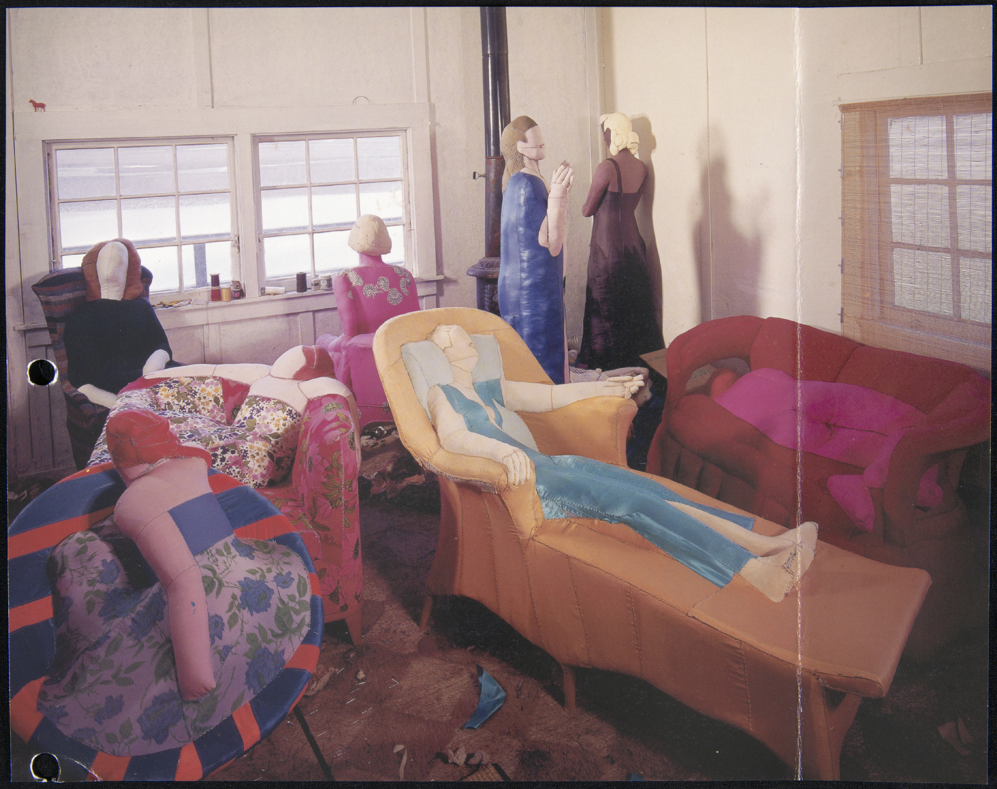 stuffed textile works of women sitting or reclining, melding into furniture
