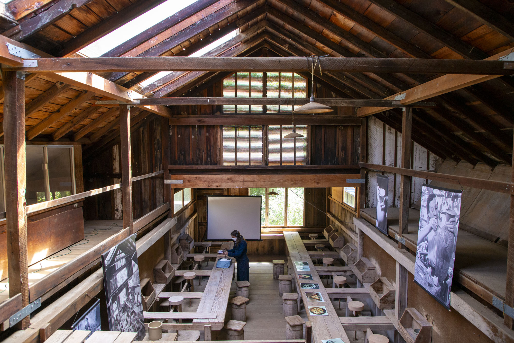 interior view of ceramics studio with rows of kick-wheel stations