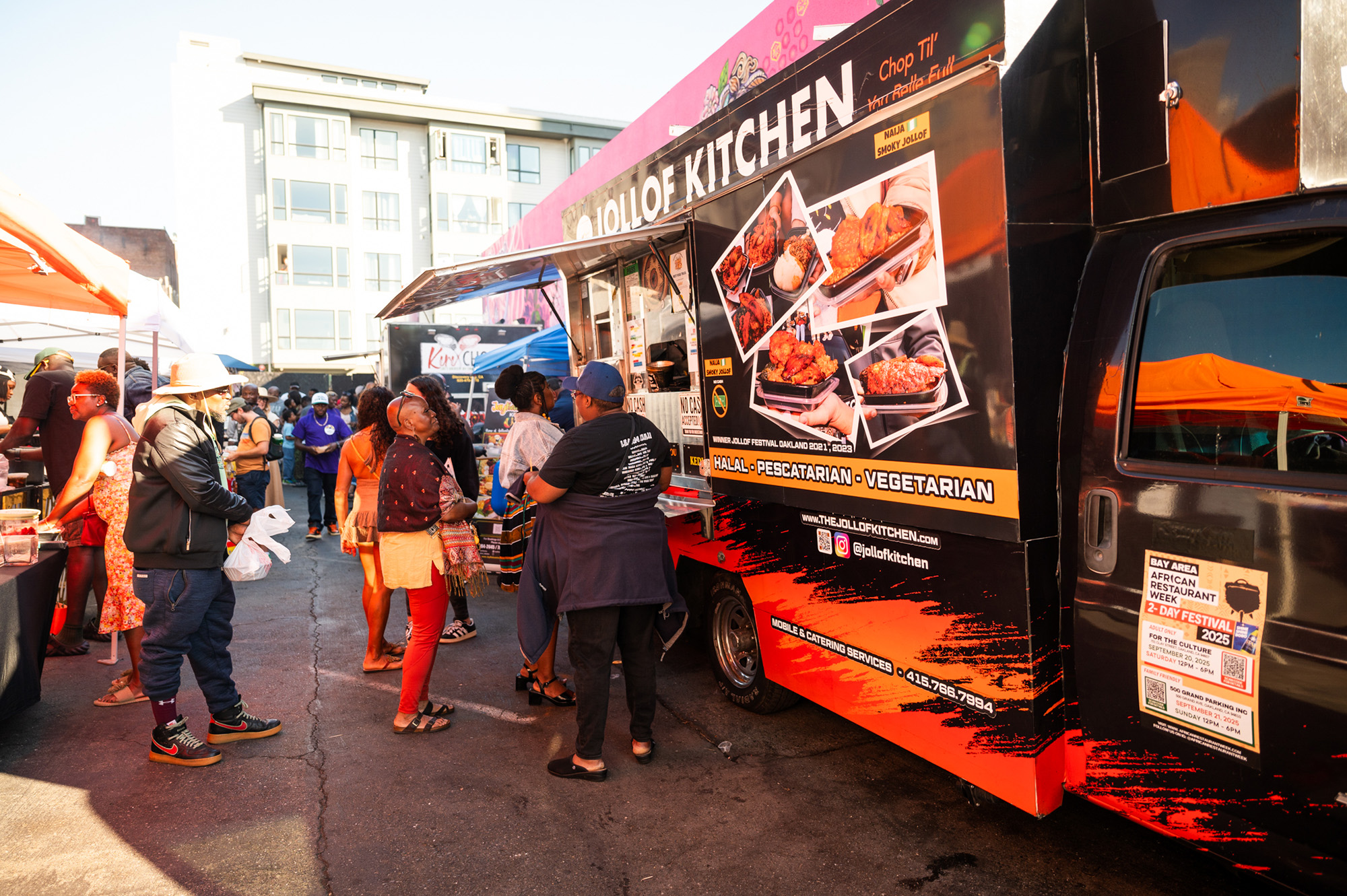 Customers lined up to buy food from the Jollof Kitchen food truck.