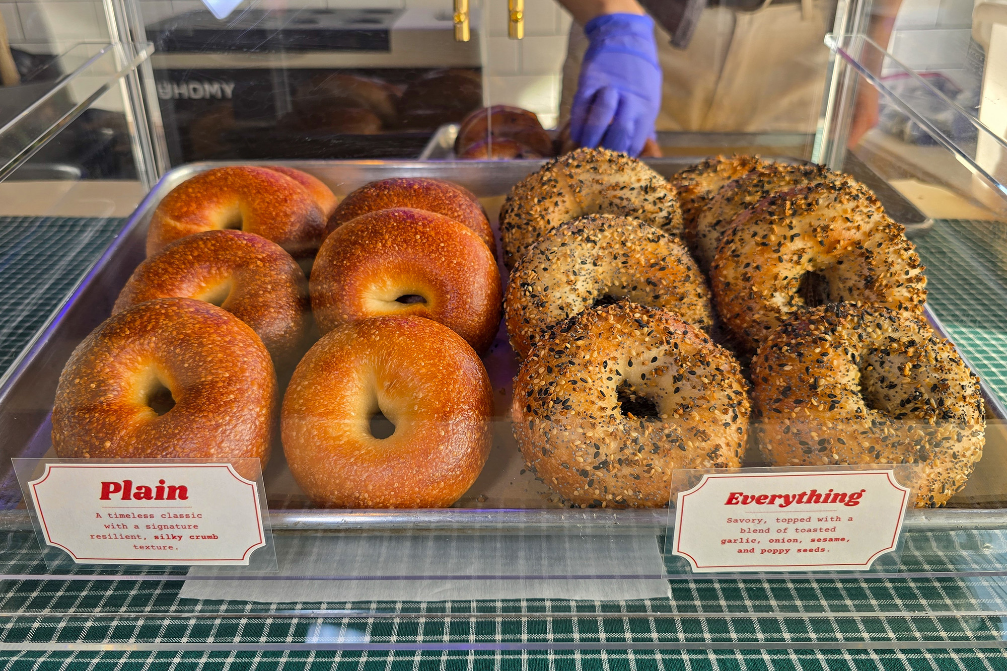 A display of plain and everything bagels.