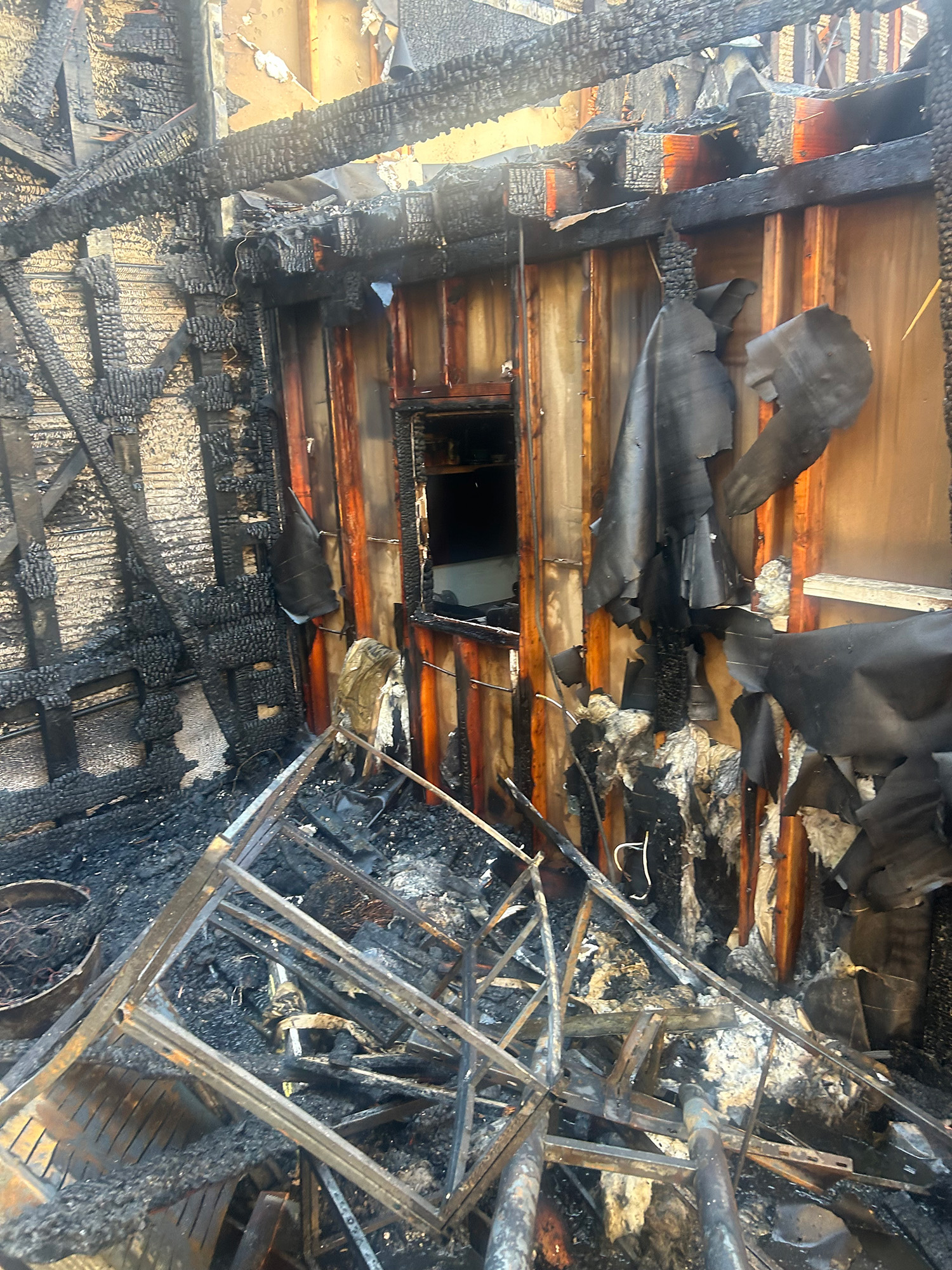 The charred remains of a burned building.