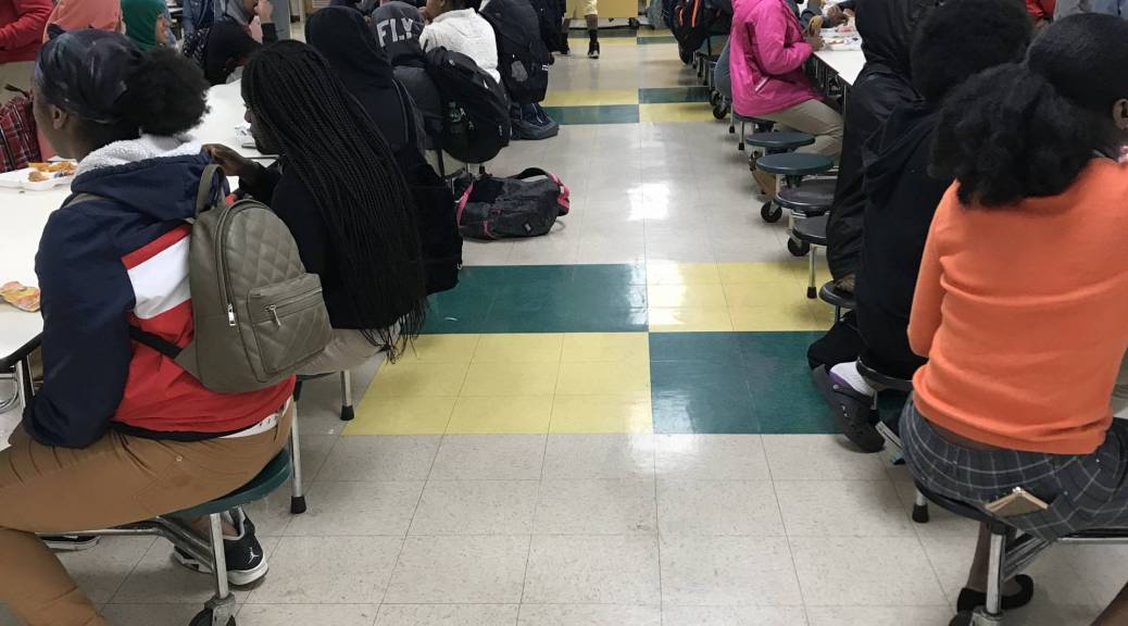 Middle school students in a cafeteria during lunch