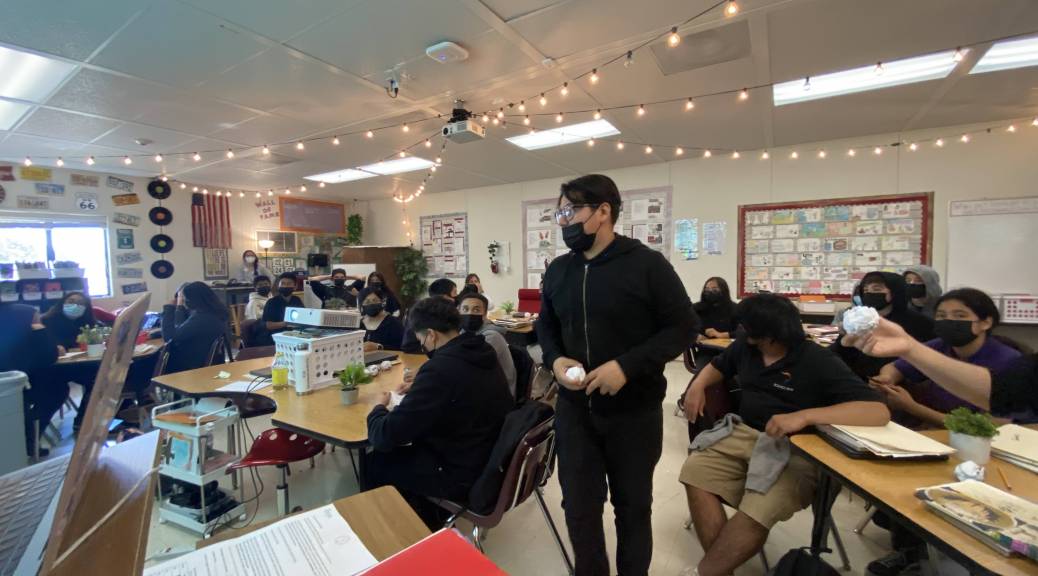 Student gets up in classroom to participate in an activity