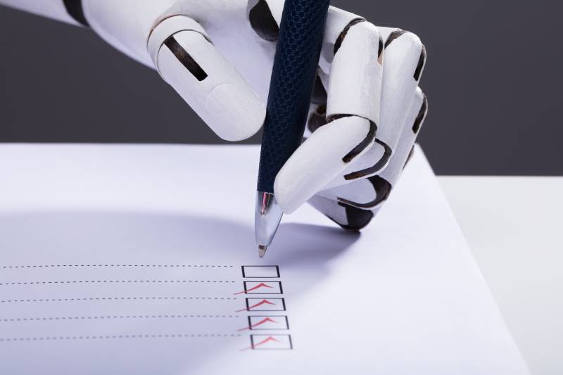 Close-up Of A Robot Hand Ticking Off Checkboxes On Document With Pen