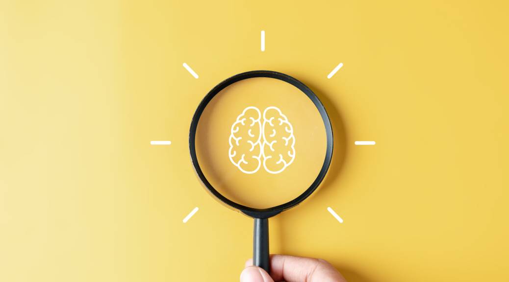 Illustration of a brain magnified by a magnifying glass