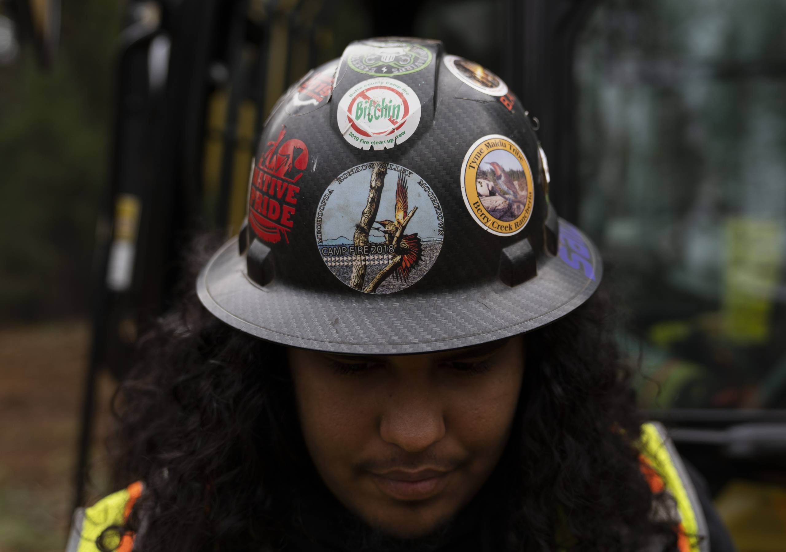 Person with helmet covered with stickers