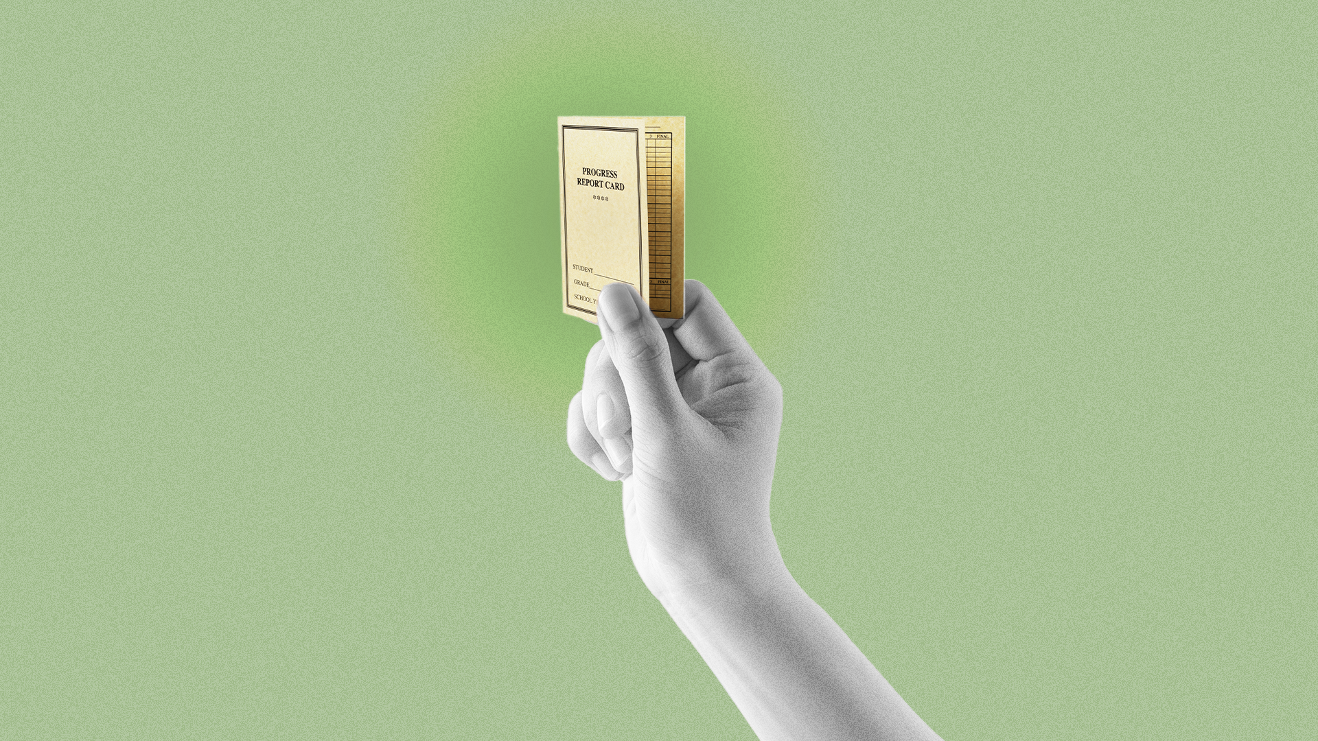 A hand holding up a small document