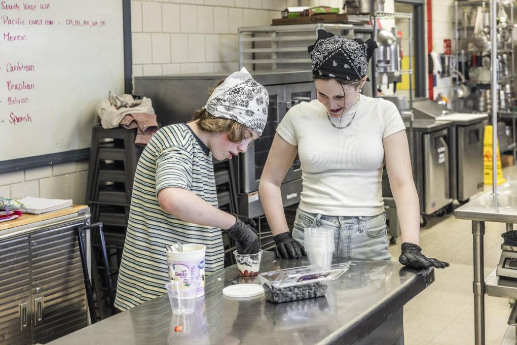 Students preparing food in cafeteria