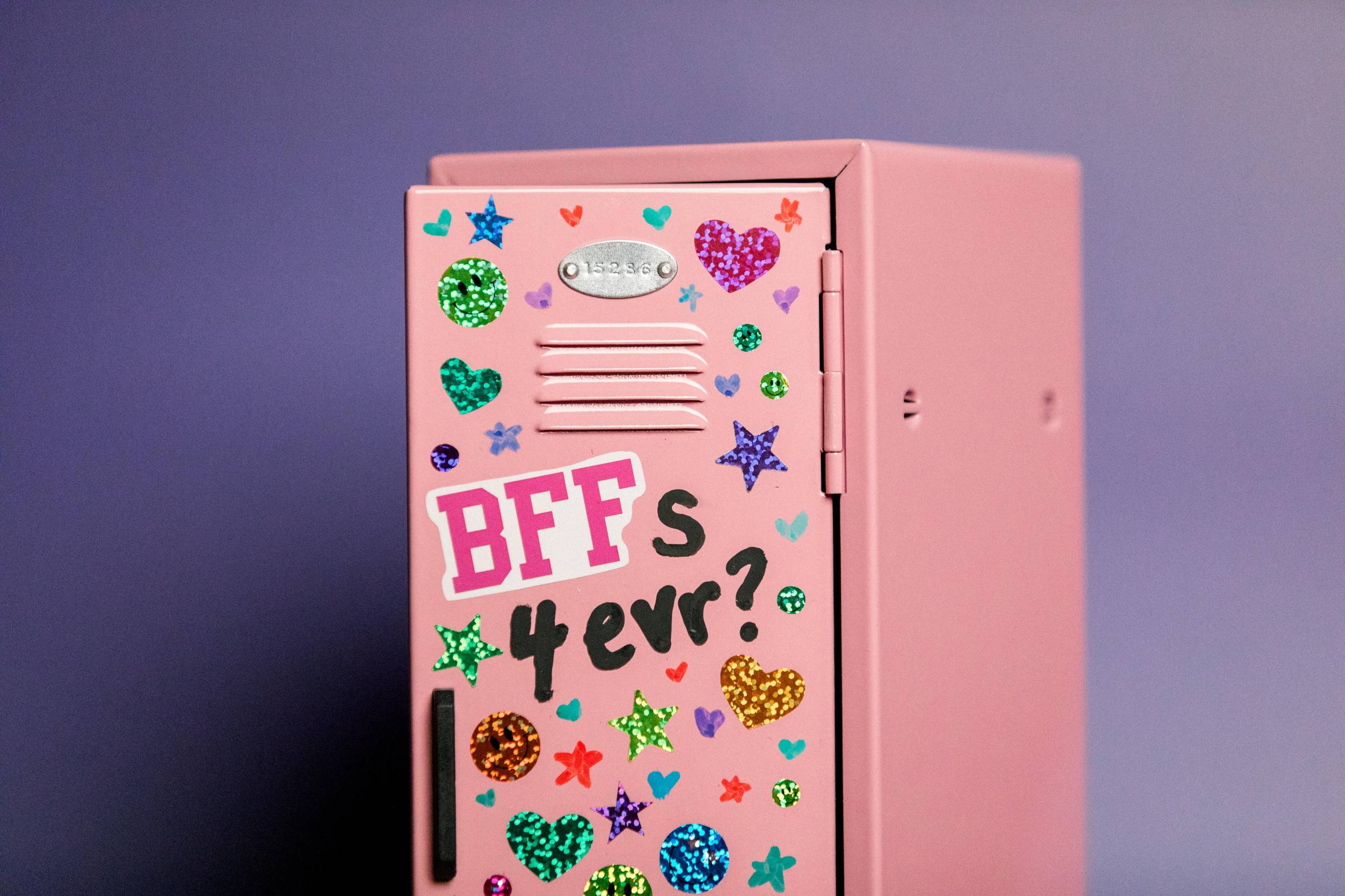 A photograph of a school locker covered in stickers
