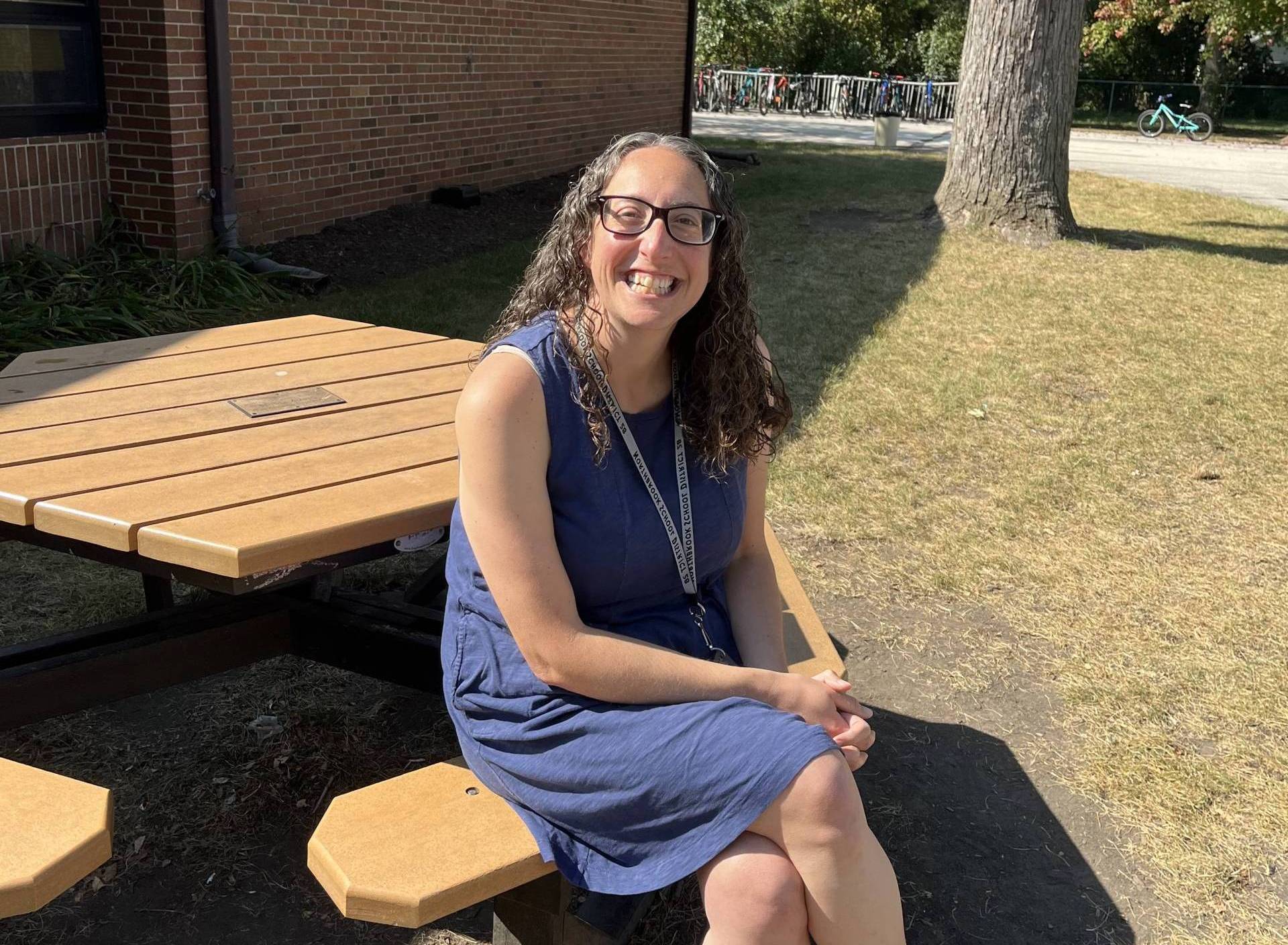 Woman sitting at bench