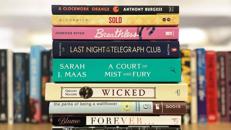 A stack of books on a table.