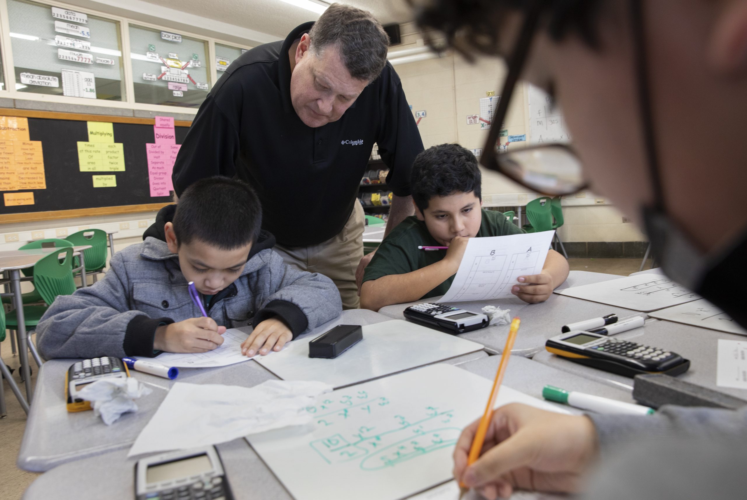 Male teacher with students