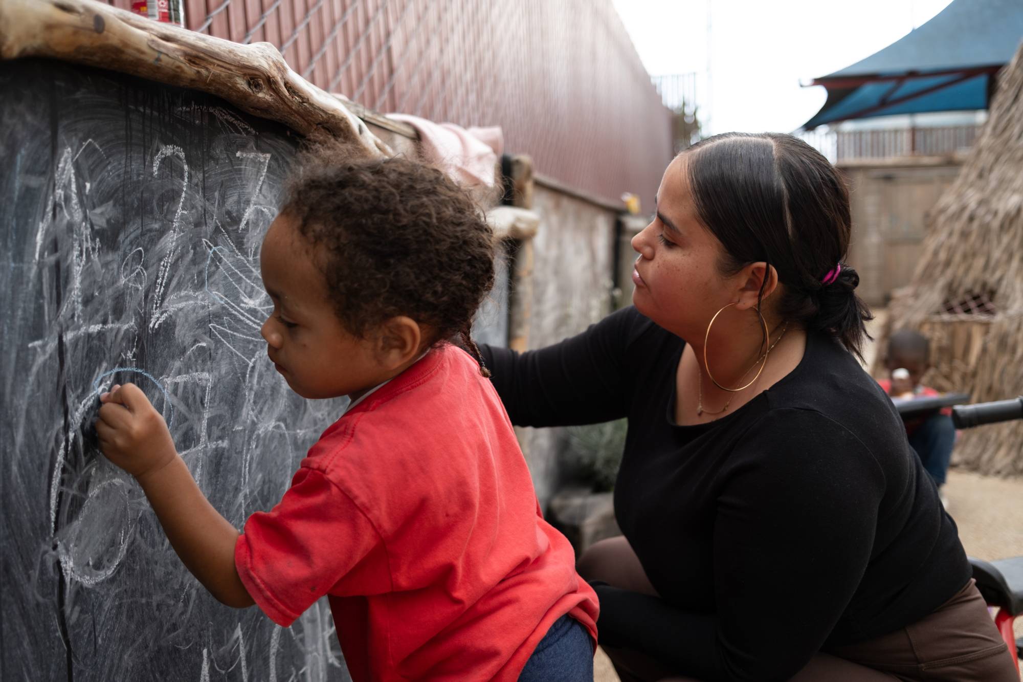 Child working alongside adult