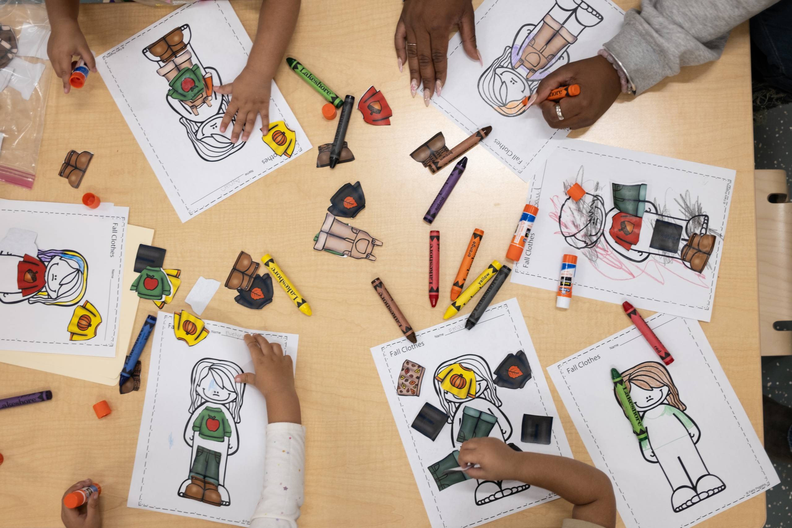 Kids working with art supplies at a table
