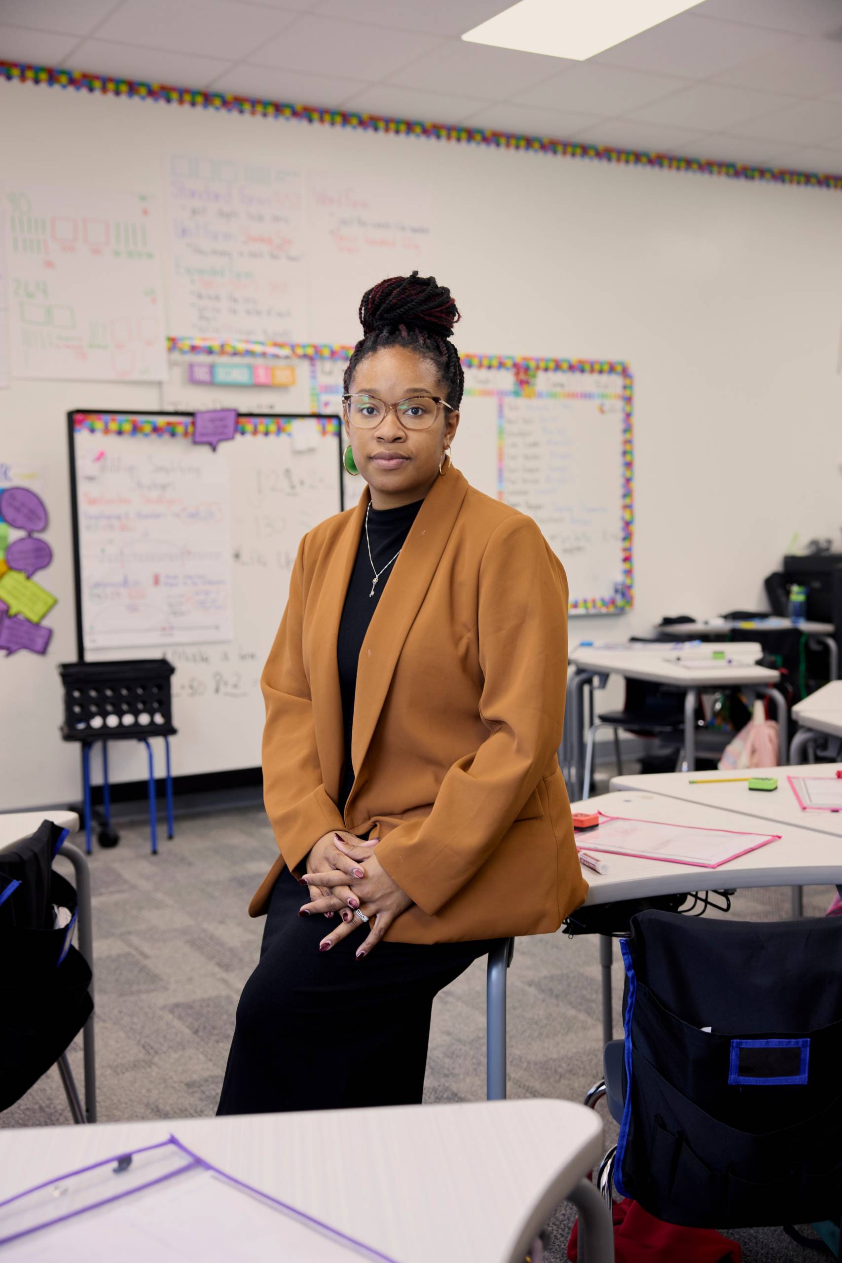Woman leaning on desk