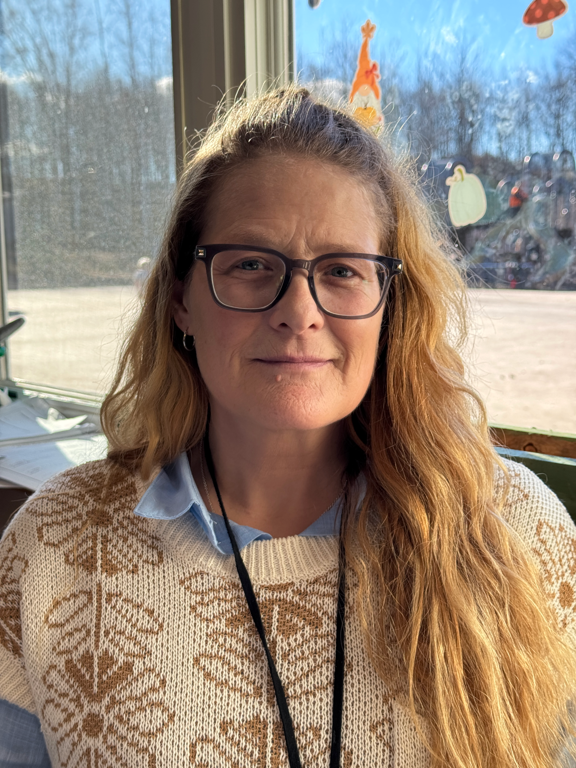 Woman in front of window