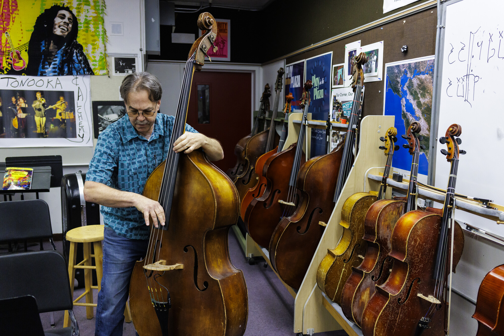 Man holding bass instrument