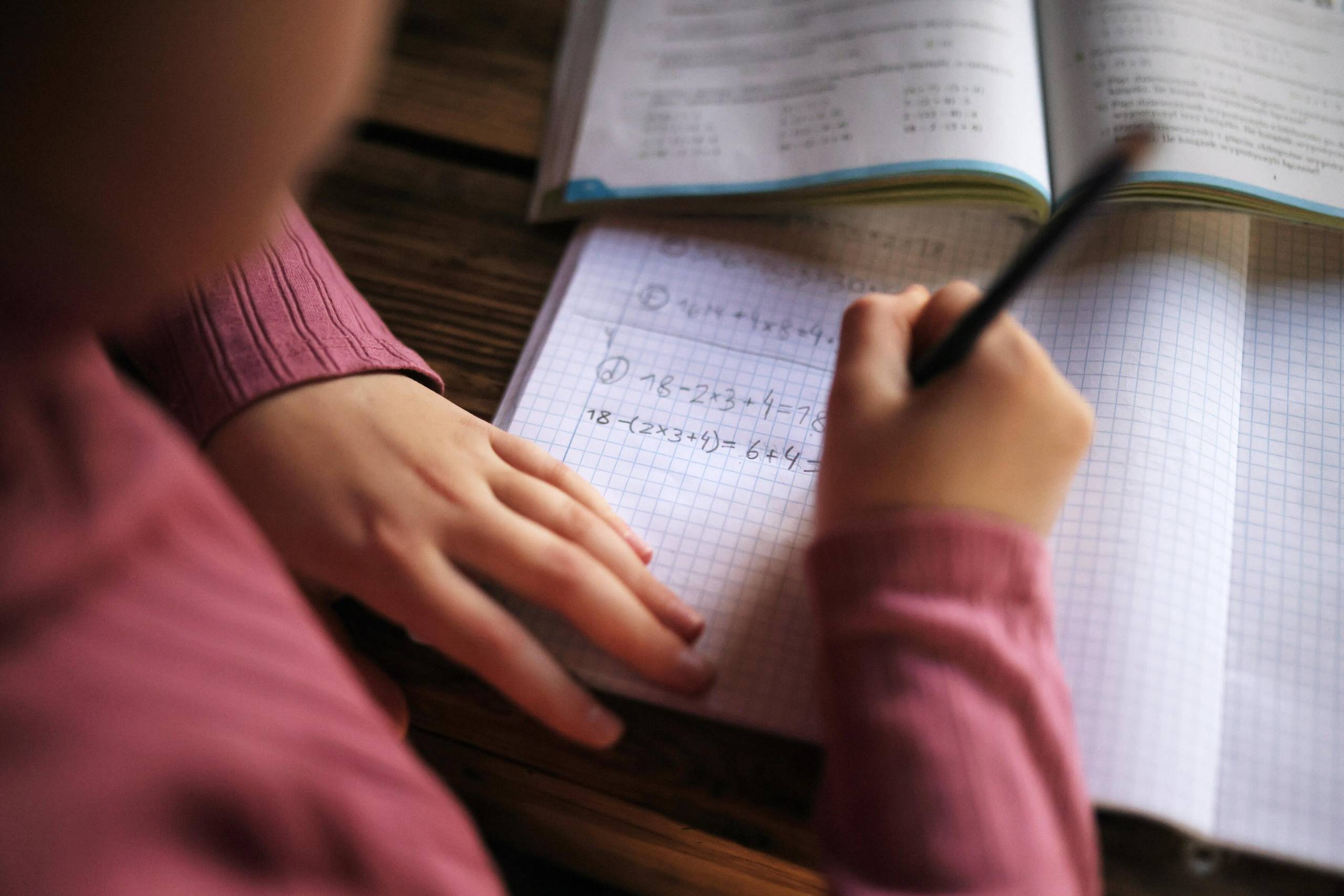 Closeup of a student doing math homework. 