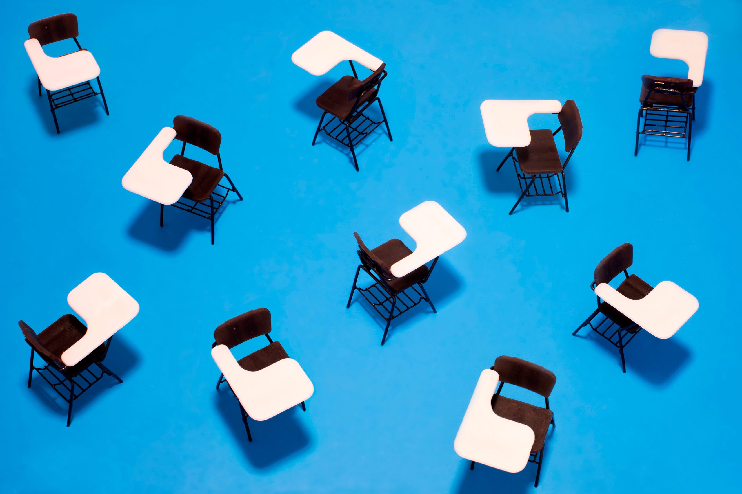 Illustration of an overhead view of empty school desks