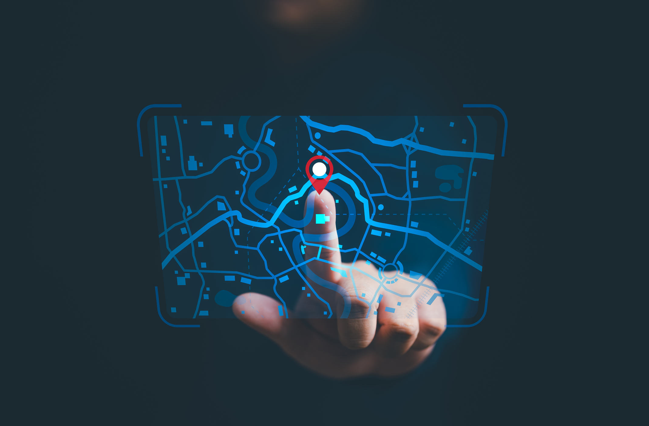 Person putting finger on someone's location tracking information on a screen.