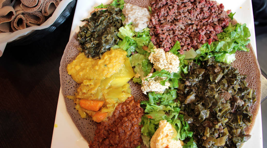 A combo platter with vegetable dishes and kitfo at Tadu Ethiopian Kitchen in SF.