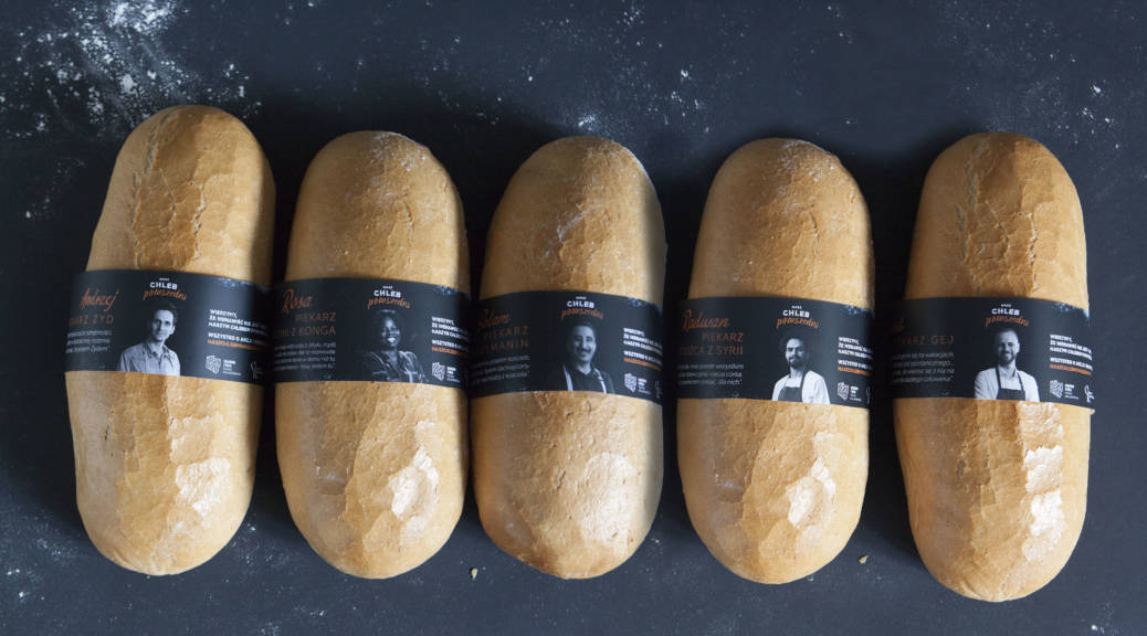 Hate crimes are on the rise in Poland. In response, a new YouTube video aspires to foster tolerance by having people from marginalized groups bake and sell bread to customers at a Warsaw bakery. Above, some of the loaves baked and handed out as part of the campaign. Each loaf is wrapped in a black ribbon with a photo and information about the person who baked it.