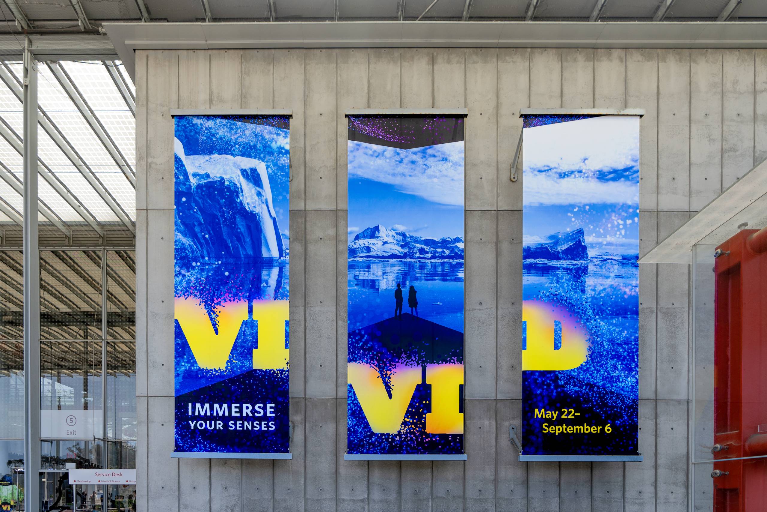 Three vertical banners promoting California Academy of Sciences' Vivid exhibit.
