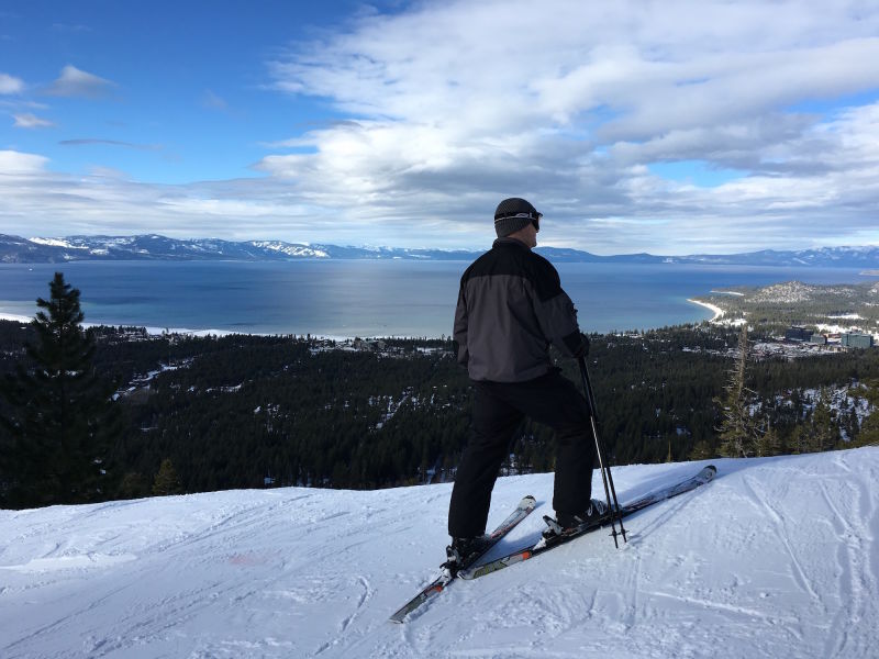 A skier surveys the view of South Lake Tahoe from Heavenly ski resort.