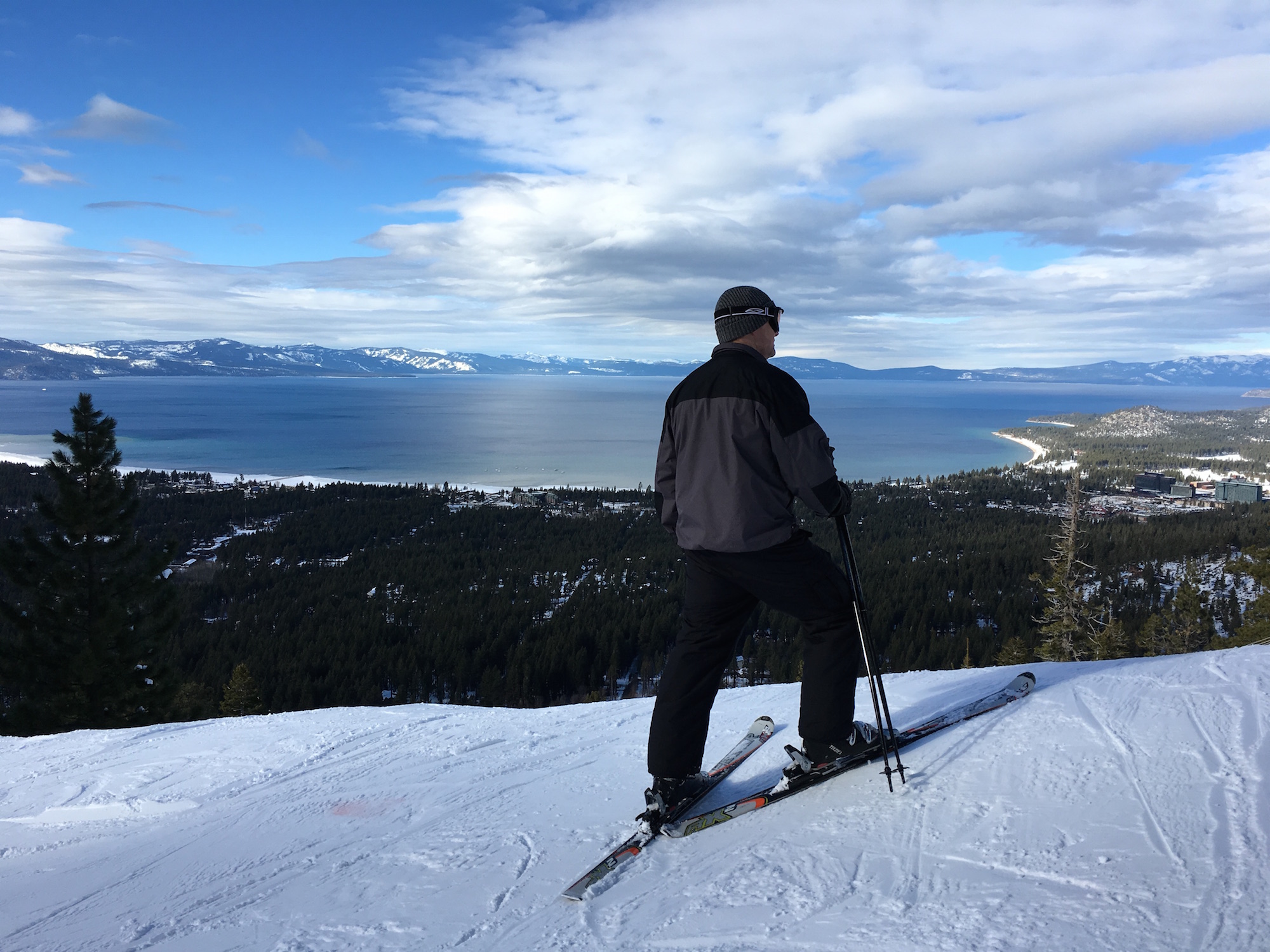A skier surveys the view of South Lake Tahoe from Heavenly ski resort.