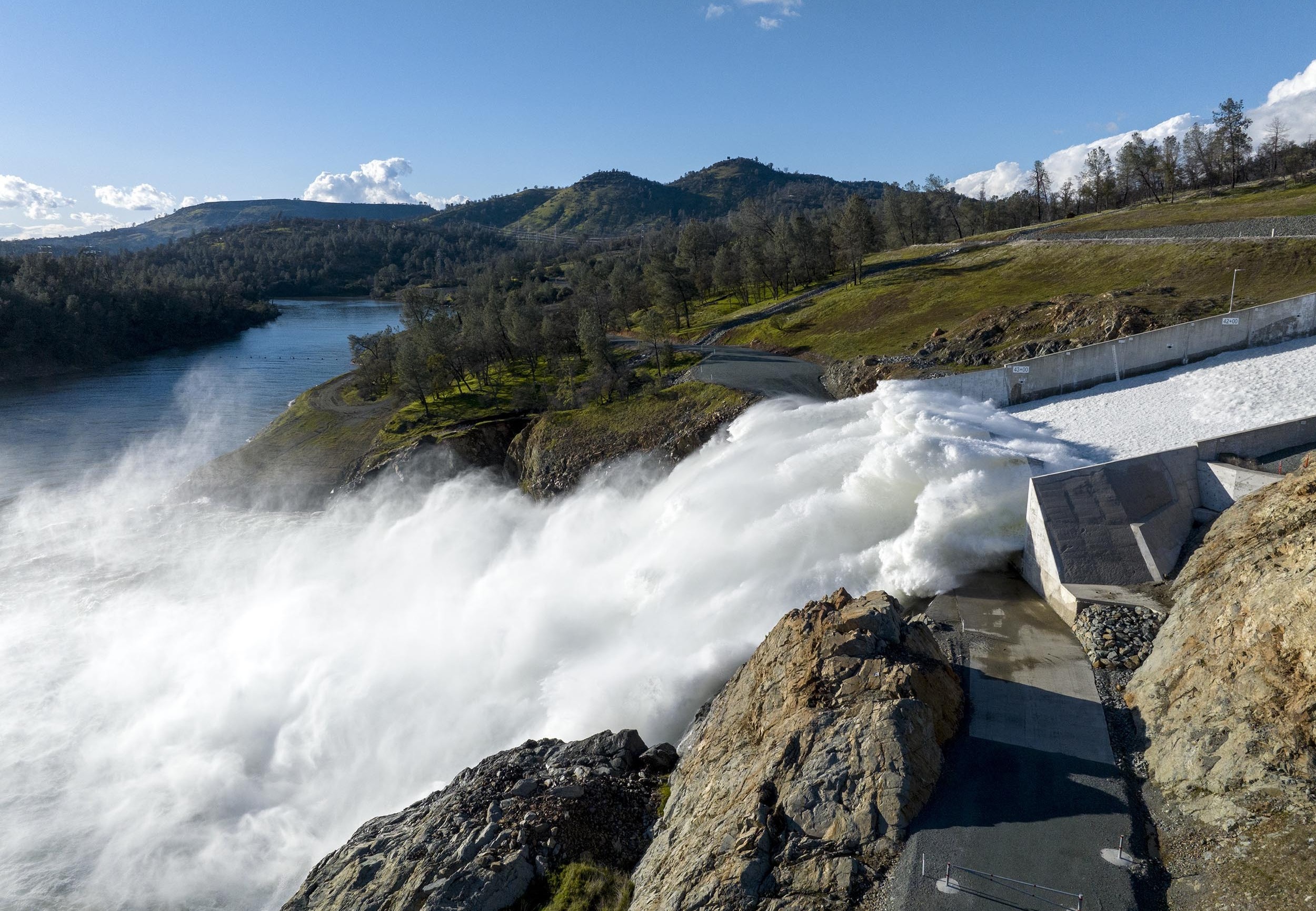 Water flowing at high speeds out of a lake.