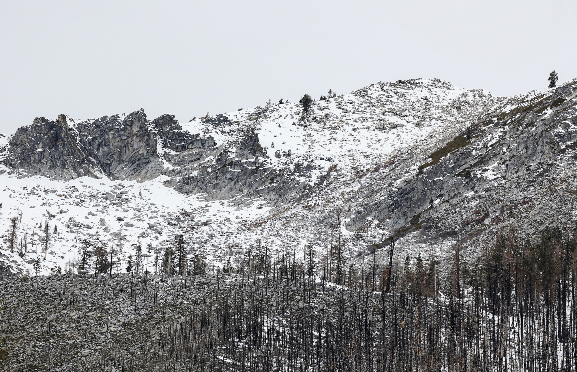 A mountaintop dusted in snow.