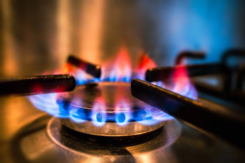 A close-up of flames on a gas stove.