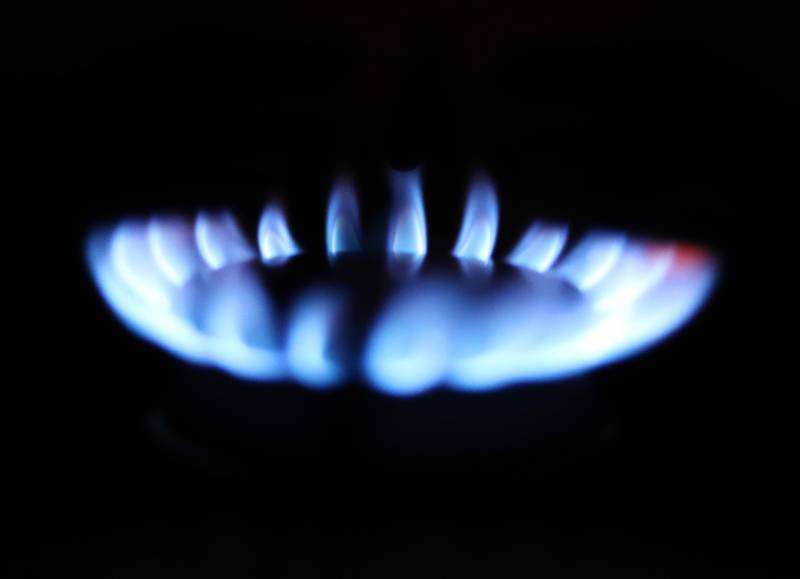 Image of a gas stove against a black background.