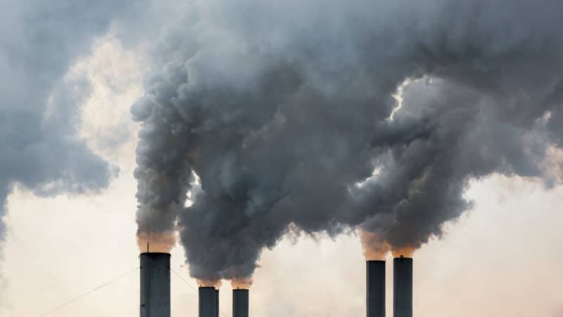 smokestacks billowing smoke.