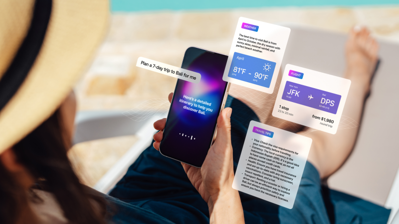 Over the shoulder view of a young woman using artificial intelligence to plan a trip.